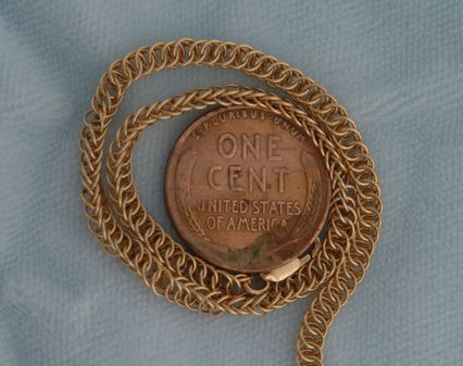 Some chain, with penny for comparison.
