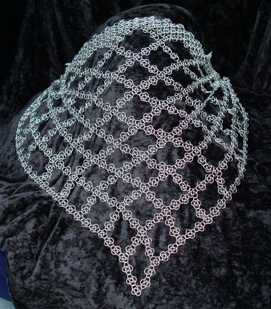 Silver knotted mail scarf.