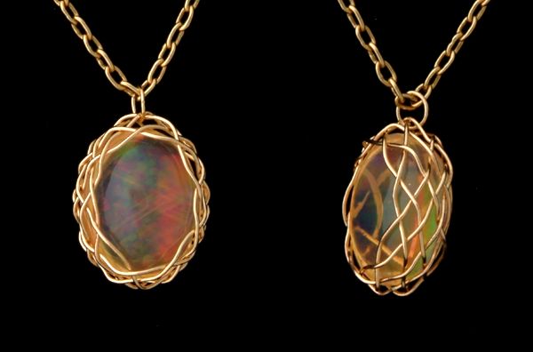 Two views of Mexican Fire Opal in 7x9 Turk's Head setting.