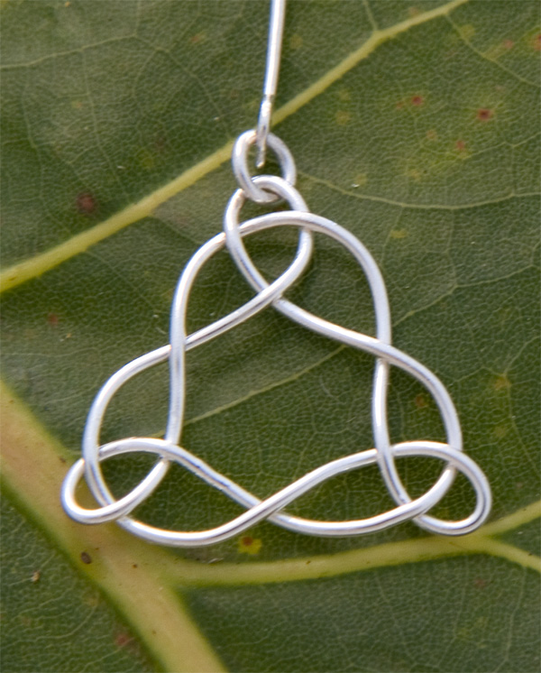 Celtic triangle earring in fine silver.