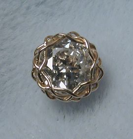 closeup of front of diamond earring