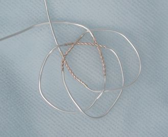 Spliced wire starting a knot.
