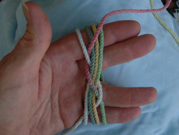 Tying a seven-lead nine-bight knot in hand.