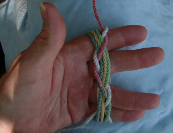 Tying a seven-lead nine-bight knot in hand.