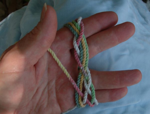 Tying a seven-lead nine-bight knot in hand.