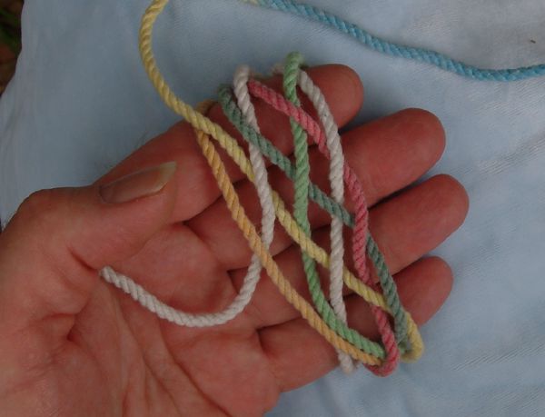 Tying a seven-lead nine-bight knot in hand.