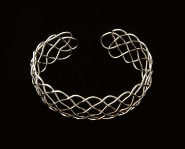 nineteen loop single strand Prolong Knot in fine silver.